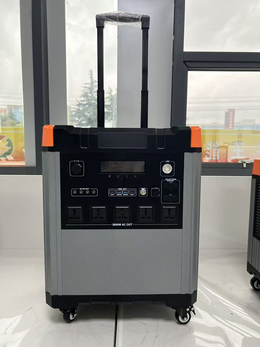 Portable lithium power station on casters with status display and AC outlets