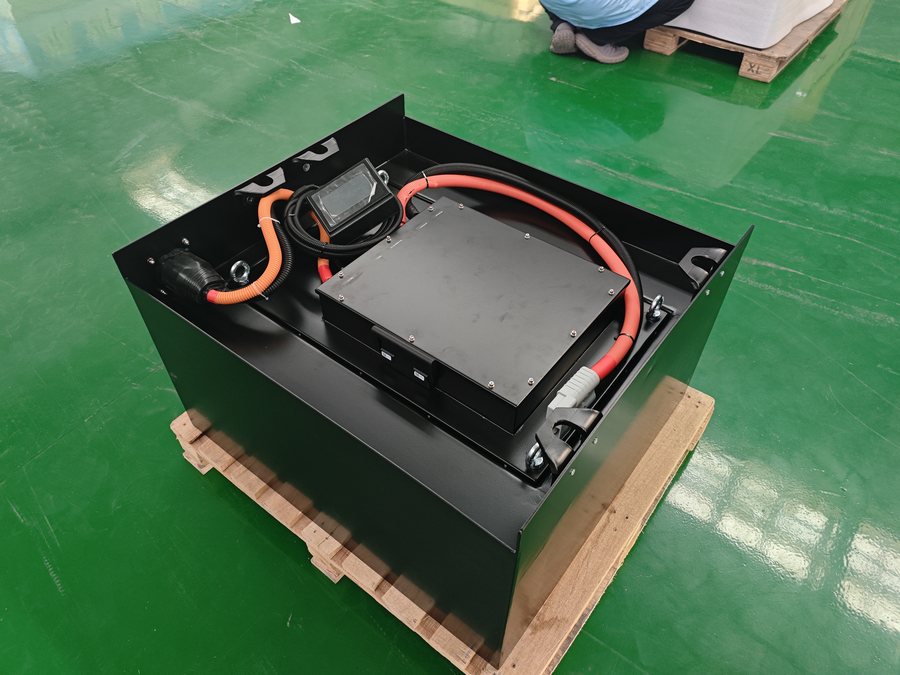 Open LiFePO4 traction pack showing the battery management system and orange high-voltage cabling