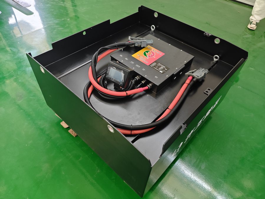 Black LiFePO4 traction pack in a steel enclosure with high-voltage cabling on top