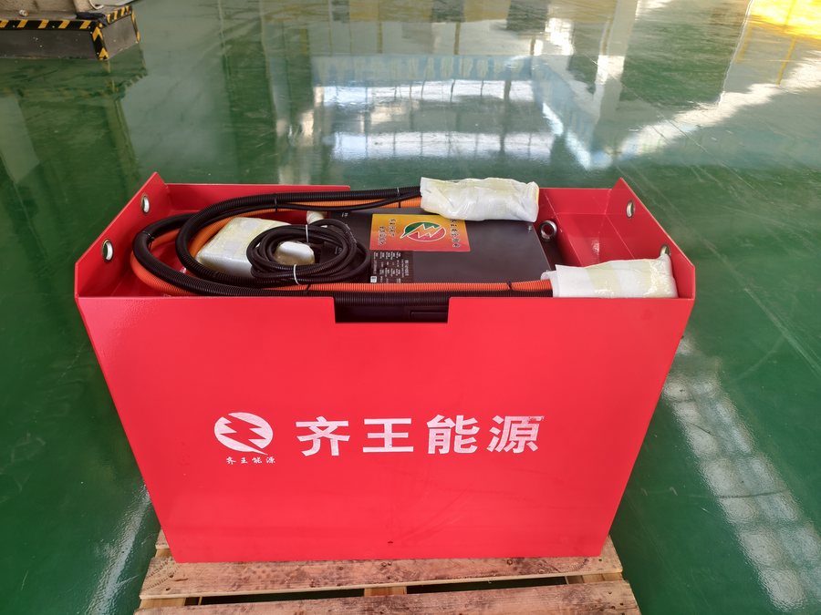 Red LiFePO4 traction pack on a pallet, ready for dispatch